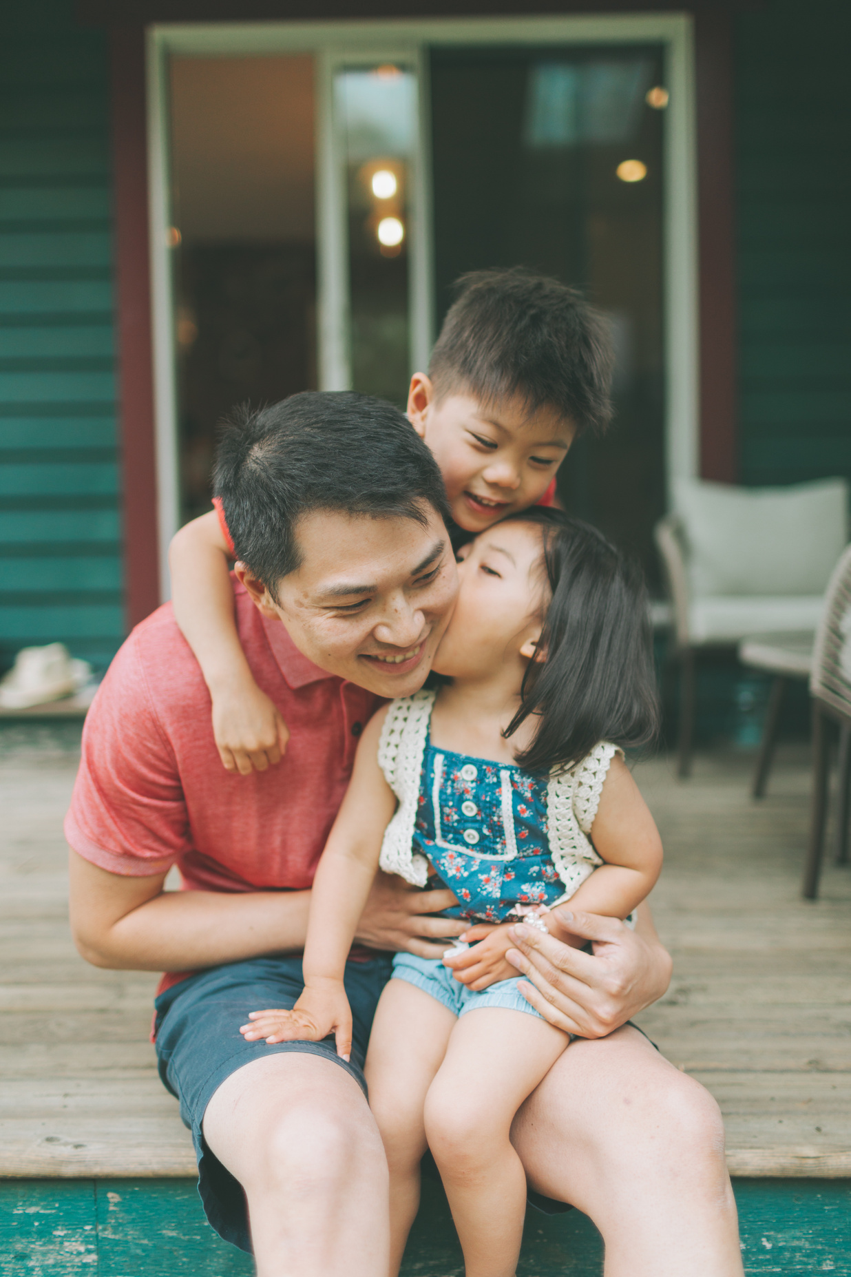 Kids With Their Dad in the Patio