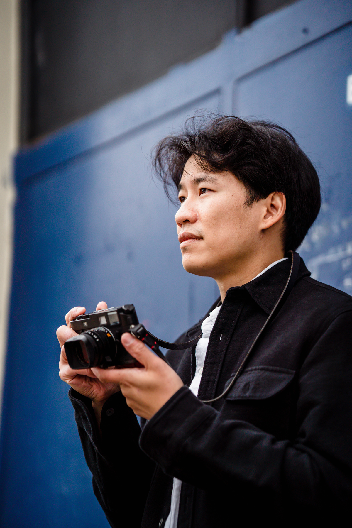 Portrait of a Man Holding a Camera 